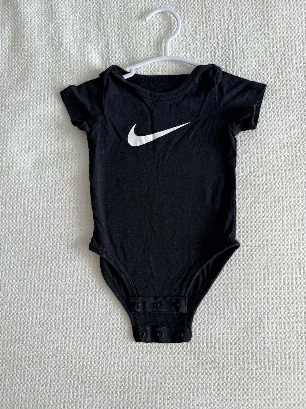 Nike Black Infant One-Piece Bodysuit with White Swoosh